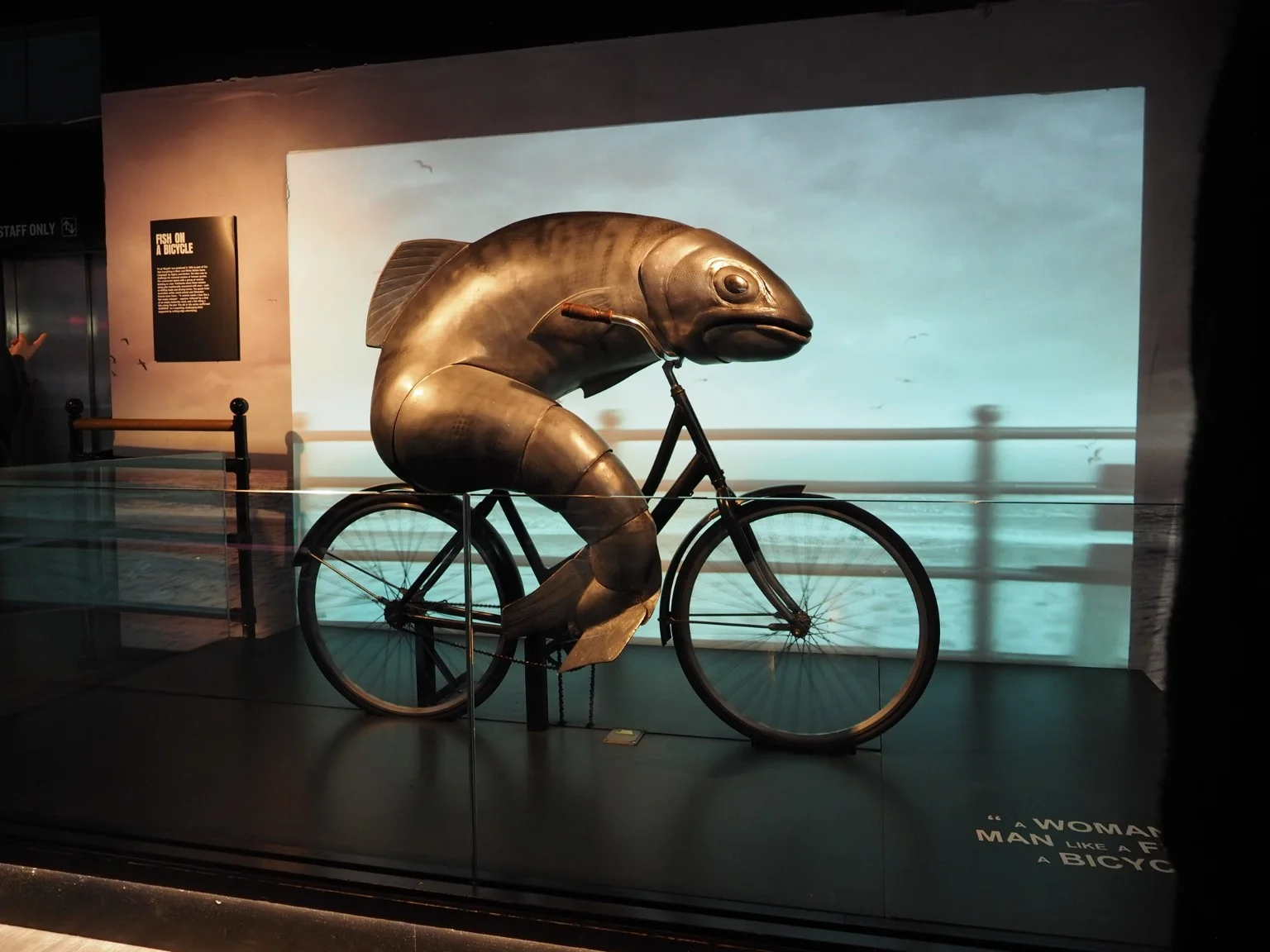 A sculptural fish riding a bicycle in the Guinness Storehouse advertising exhibition