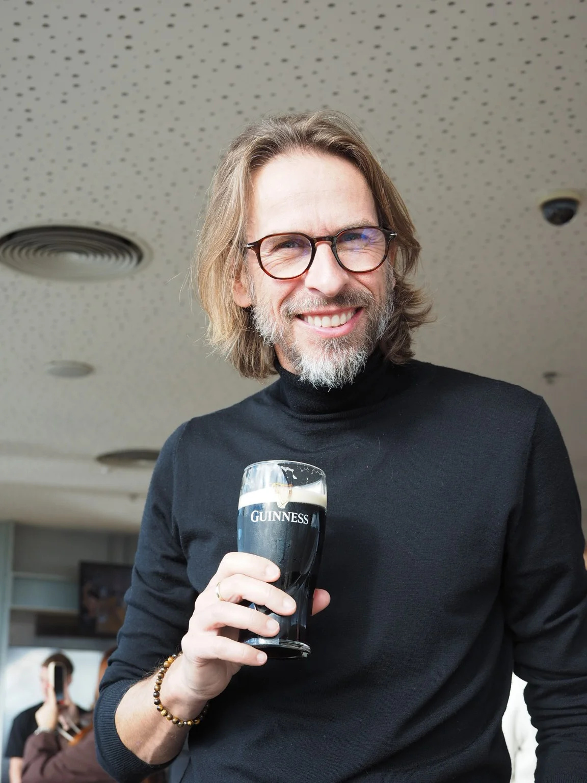 Sander Oord holding a pint of Guinness during his visit.