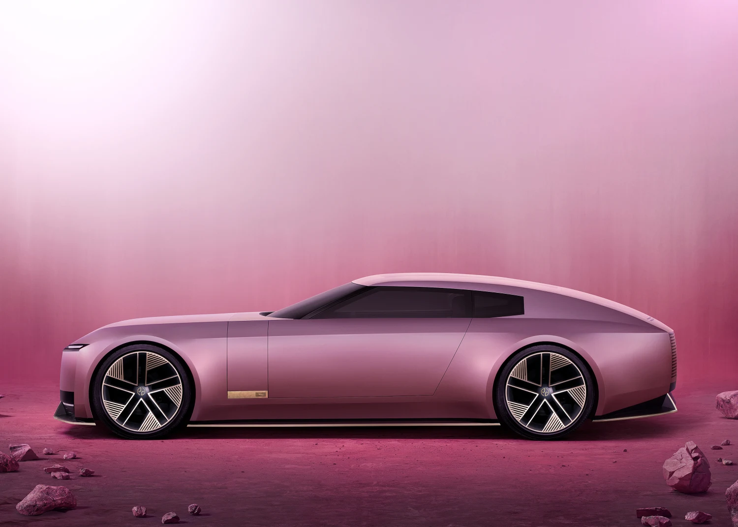 Pink Jaguar Type 00 concept in side profile, showing its long bonnet and low roof.