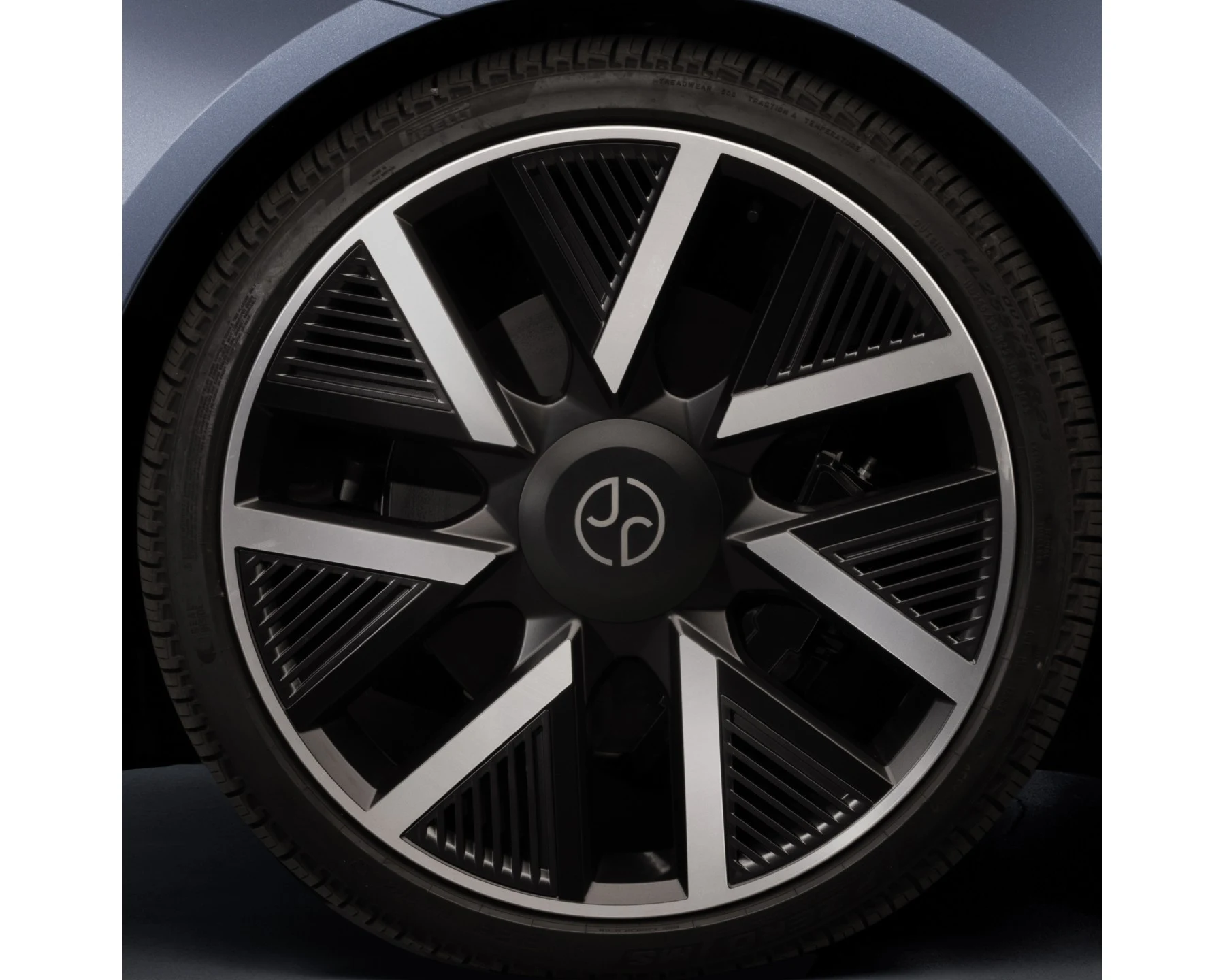 Close view of the Jaguar Type 01 wheel with five broad spokes, linear detailing and monogram